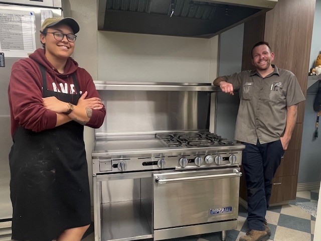 Our chef and the amazing dude who helped set up the range posing with the range.